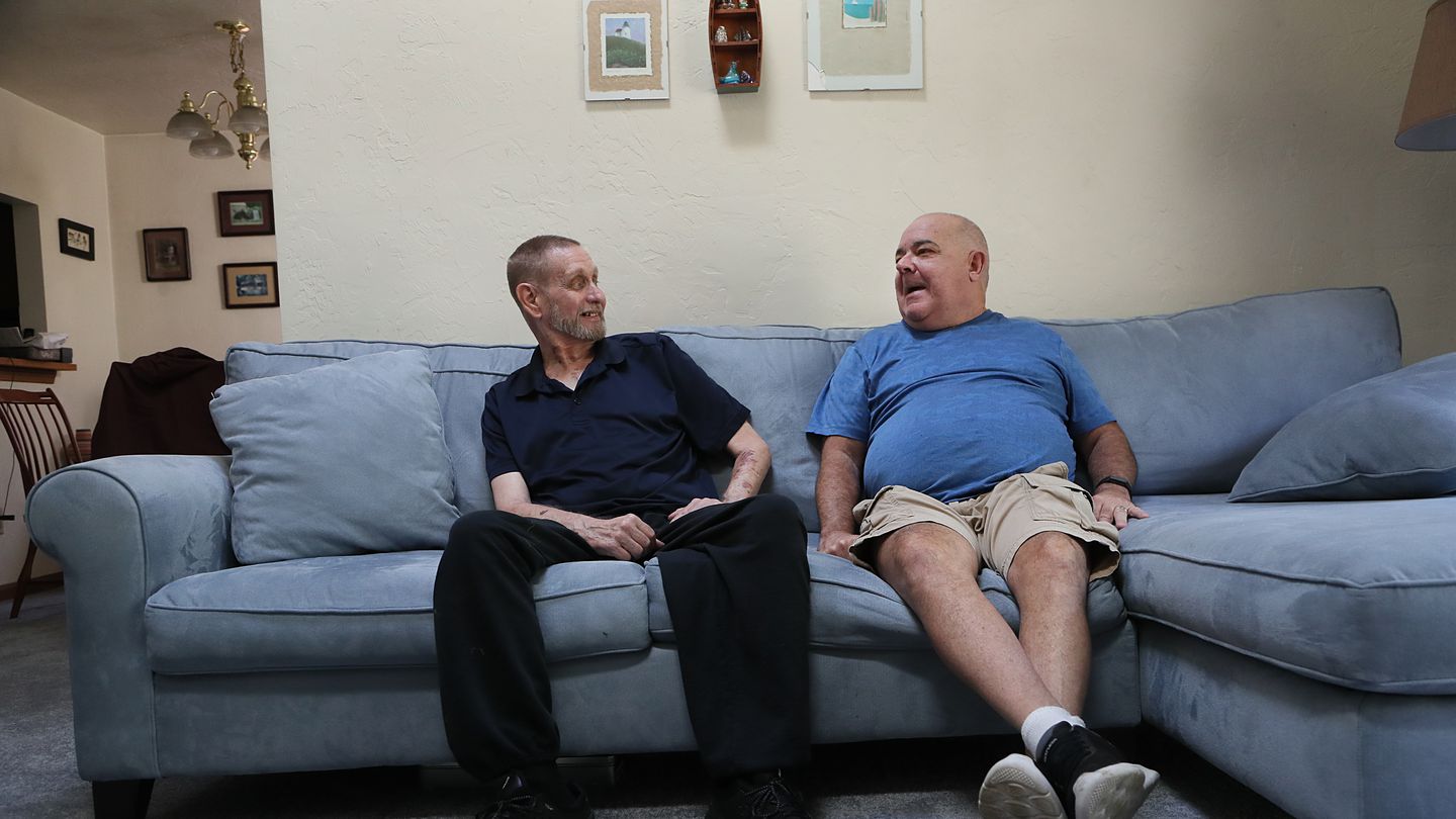 David Kornwolf, left, and Jay Toland, right, at Kornwolf’s home in Oxford. Despite barely knowing each other at the time, Toland drove Kornwolf from Oxford to Boston, where Kornwolf received a heart transplant in early September.