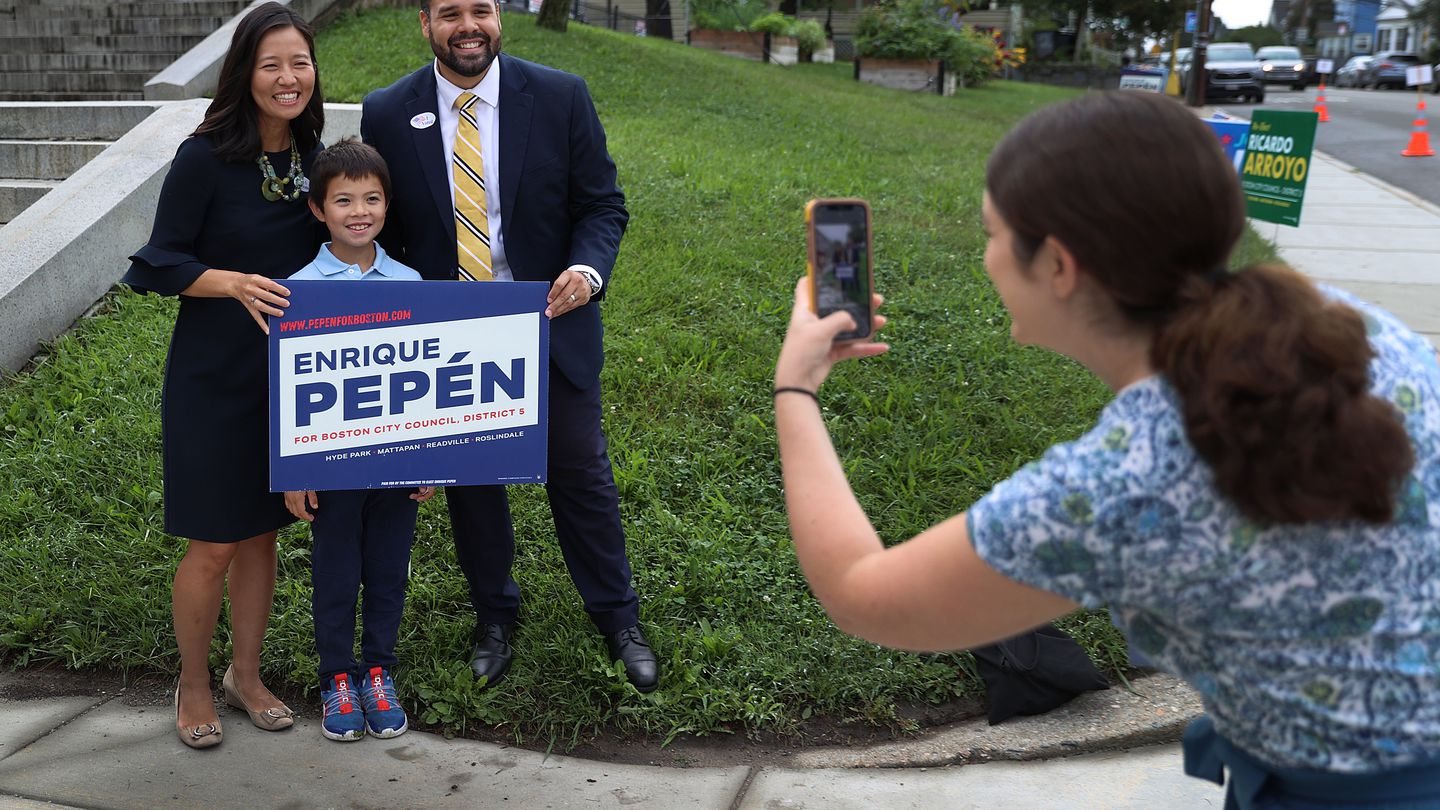 Mayor Michelle Wu and her son Blaise Pewarski joined Enrique Pepén on the day of the primary election in Boston last month.