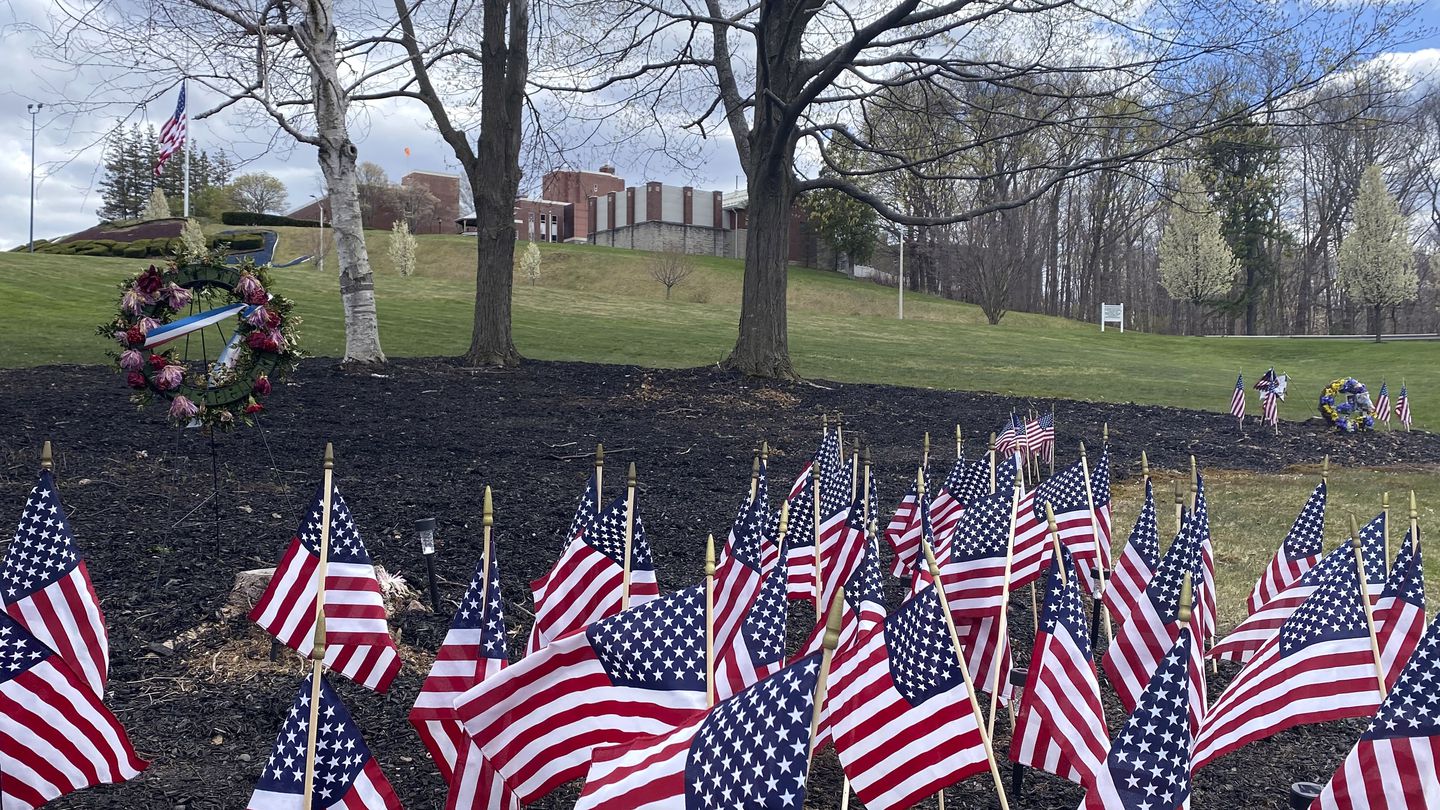 Flags and wreaths honored veterans on the grounds of the Soldiers' Home in Holyoke in 2020, when a number of residents died due to COVID-19. The facility is now known as the Veterans Home of Holyoke, and a new cluster of COVID cases was reported at the facility this week.