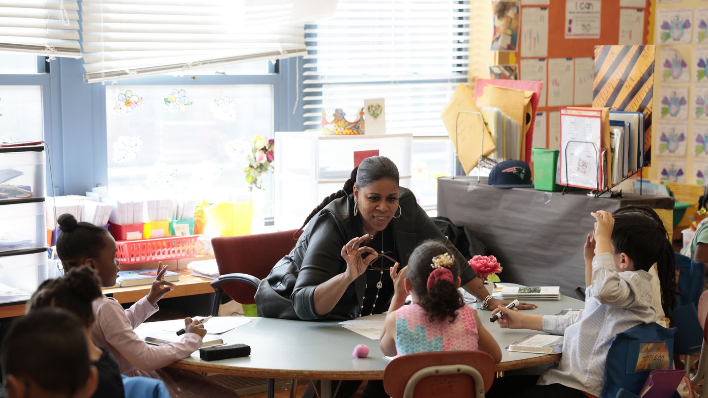 Kindergarten teacher Adina Thomas helped her students tap out sounds in words at the Haynes Early Education Center in Roxbury, part of a reading revolution in Boston Public Schools aimed at bringing instruction in line with the latest brain science.