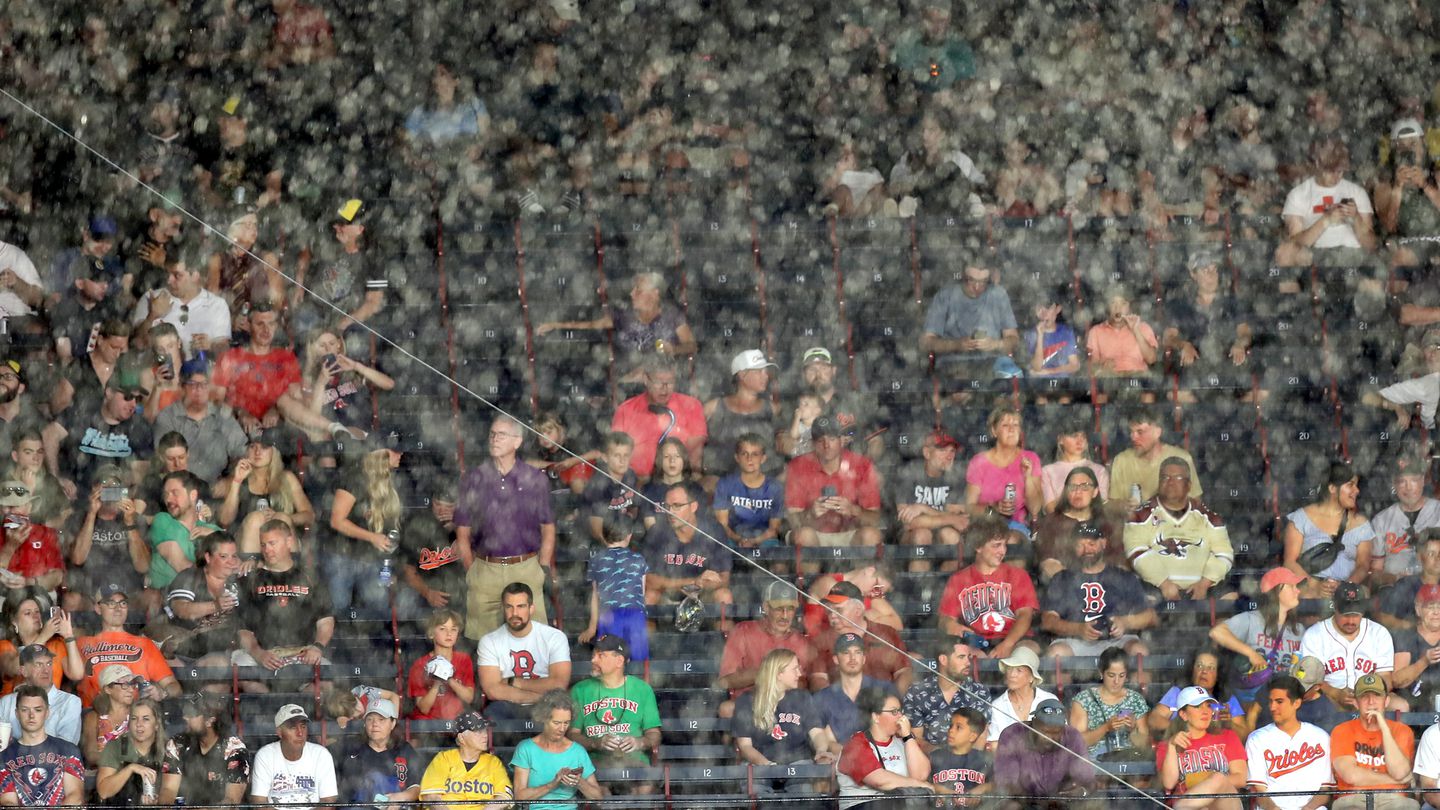 Heavy rain forced fans to find shelter during a recent weekend game between the Red Sox and Orioles.
